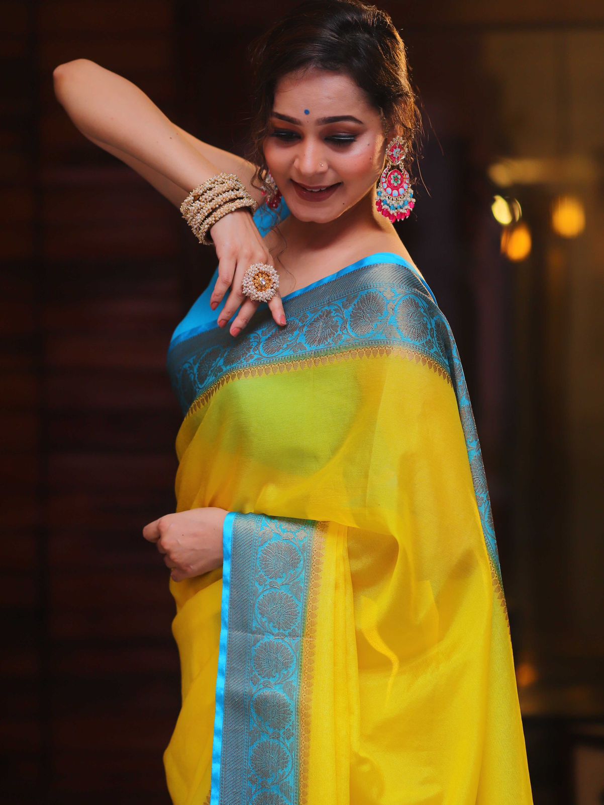 Soft & Lightweight Party Wear Elegant Yellow Nylon Chinnon Saree with Teal Border