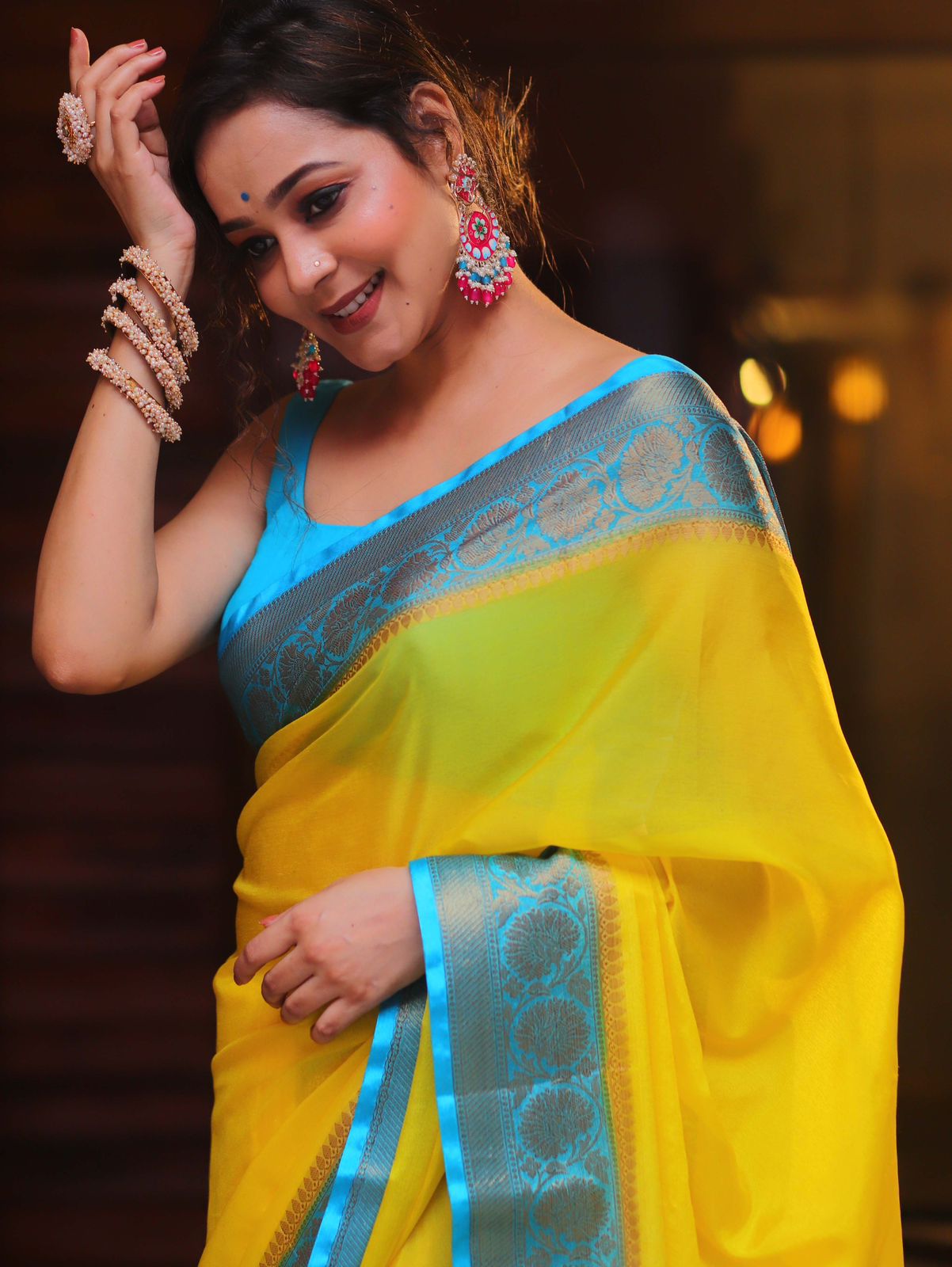 Soft & Lightweight Party Wear Elegant Yellow Nylon Chinnon Saree with Teal Border