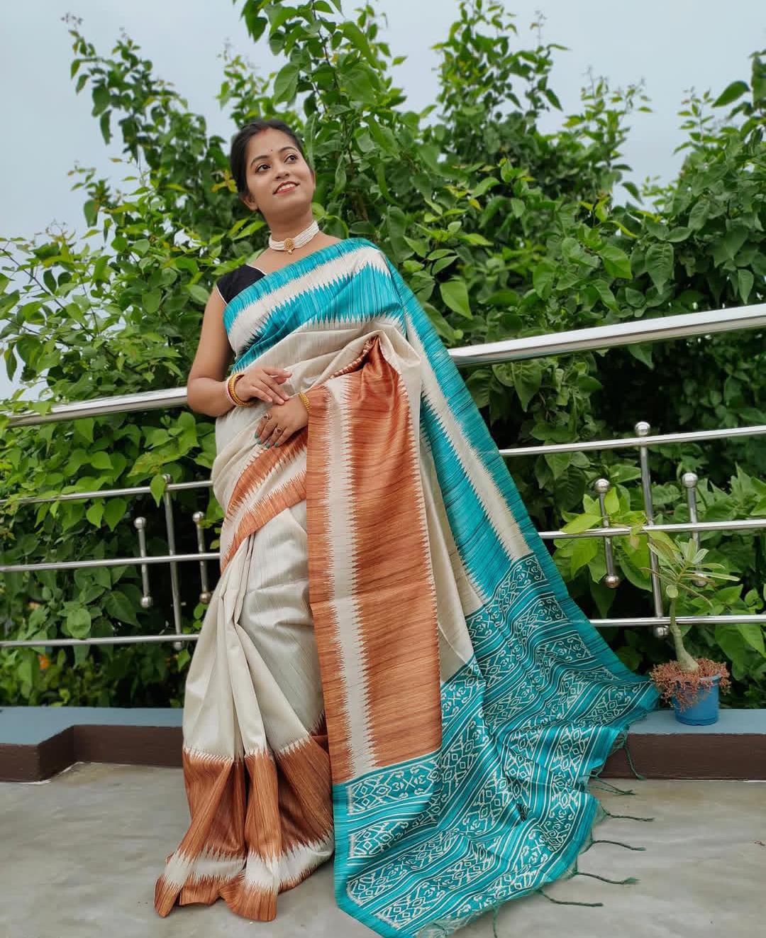 Festive Wear Off White Tussar Silk Saree with Rust-Orange & Teal Blue Contrast